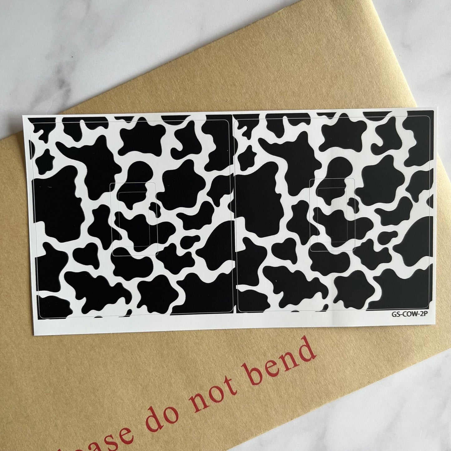 Cow Print printed vinyl cover sticker for a UK light switch