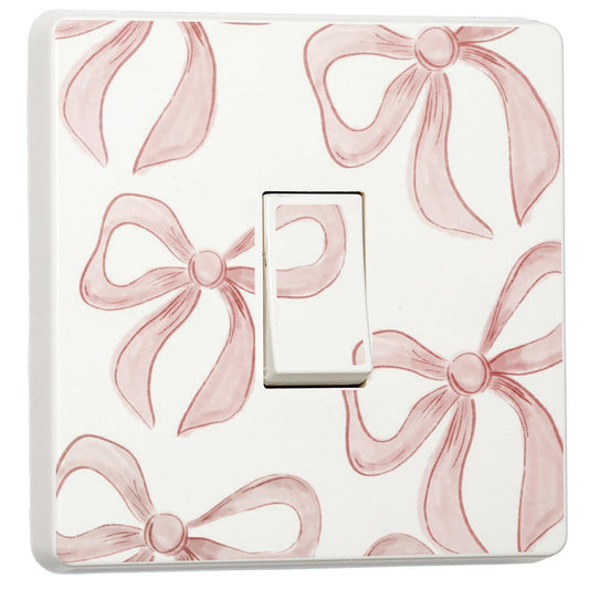 Set of 2 pink bow light switch stickers for a compatible UK single switch
