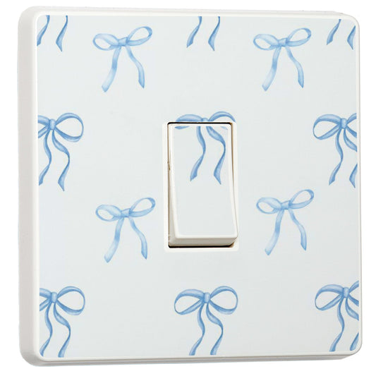 Set of 2 blue bow light switch stickers for a compatible UK single switch